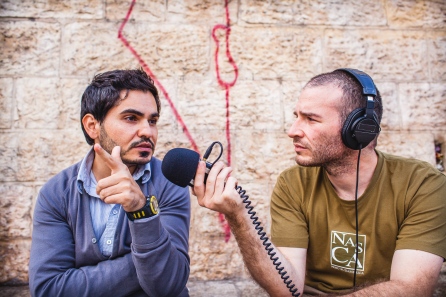 Photographs by David Feuillatre, here interviewing a Palestinian media worker at the Damascus gate in Jerusalem. Jerusalem, Israel, 2014.